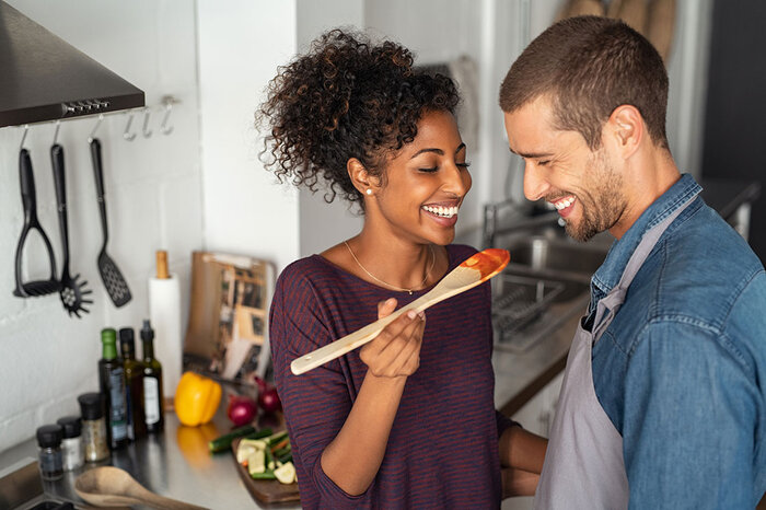 Try cooking together at home! Couple making dinner together at home