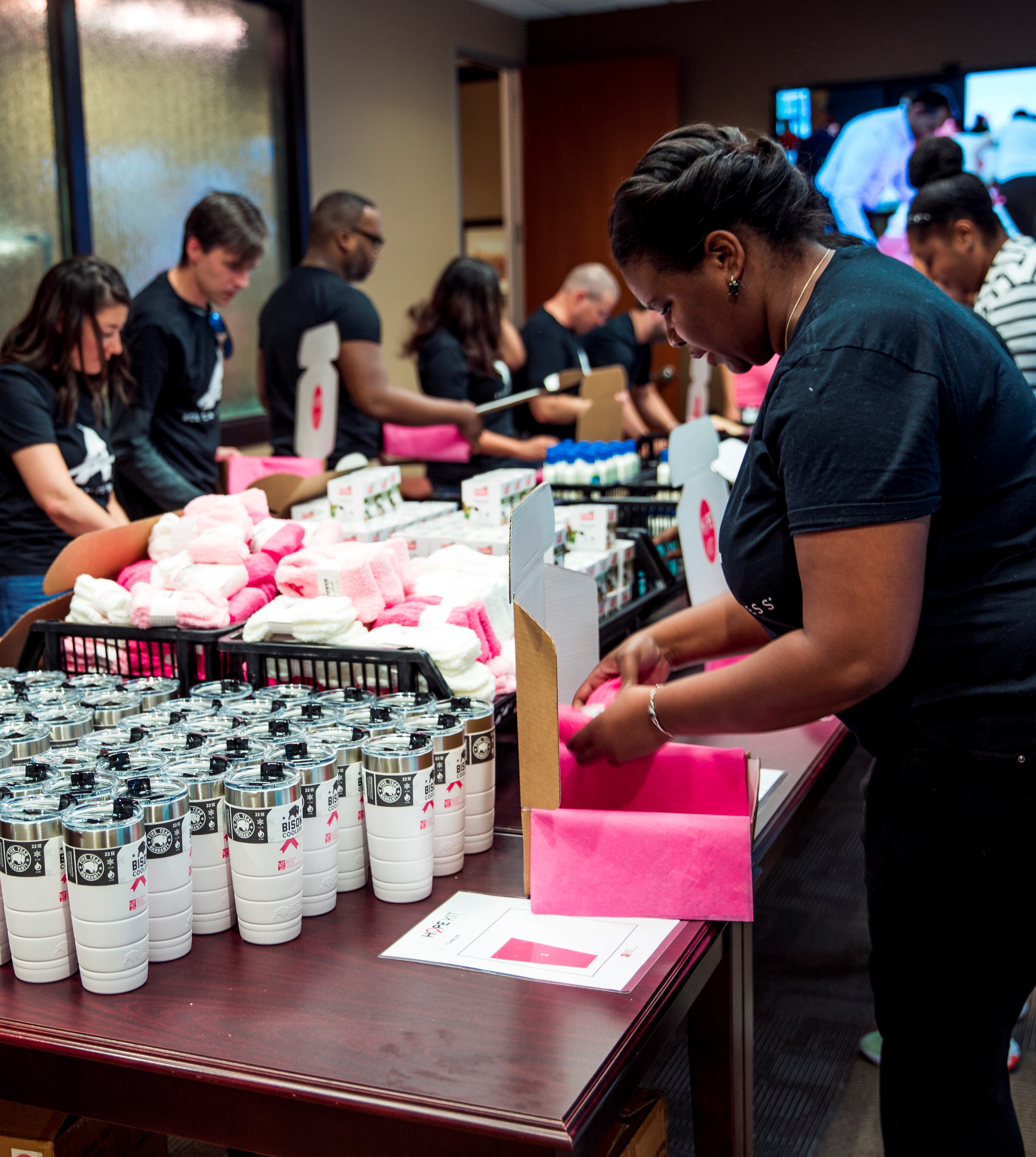 ACE team members prep HOPE Kit boxes at NBCF headquarters