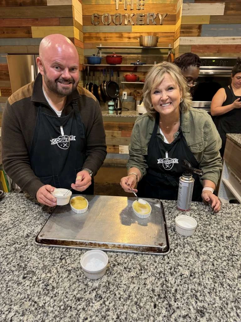 Chris Hughes and Janet Allen cooking together Chris Hughes and Janet Allen cooking together