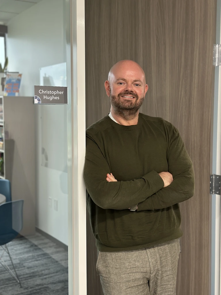 Chris Hughes standing by his office Chris Hughes standing by his office
