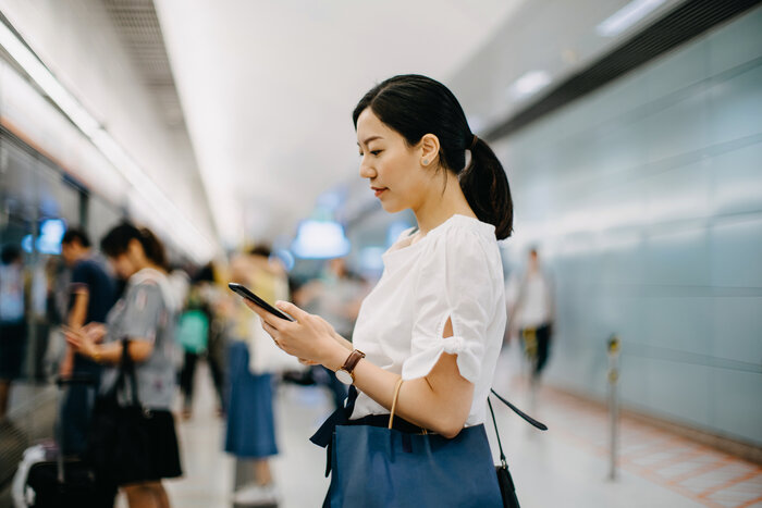 Woman Standing in Subway Station