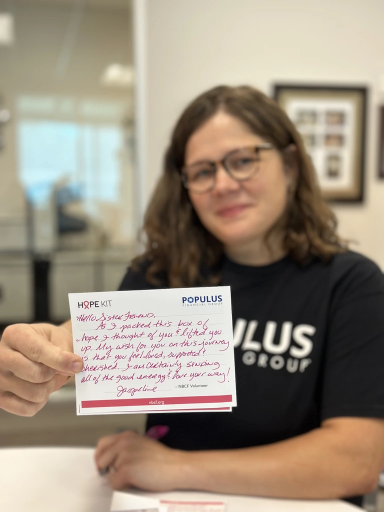 Jacqueline O., displaying her handwritten note for a HOPE Kit recipient.