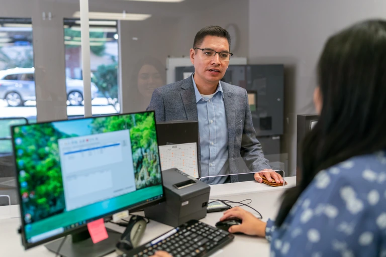 man speaking to an ACE store associate