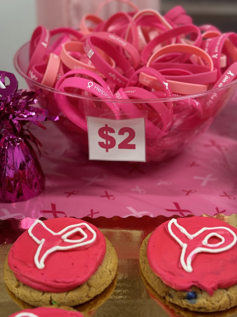 photo of Pink Day goodies at the corporate office Pink Day goodies up for sale to raise money for breast cancer awareness.